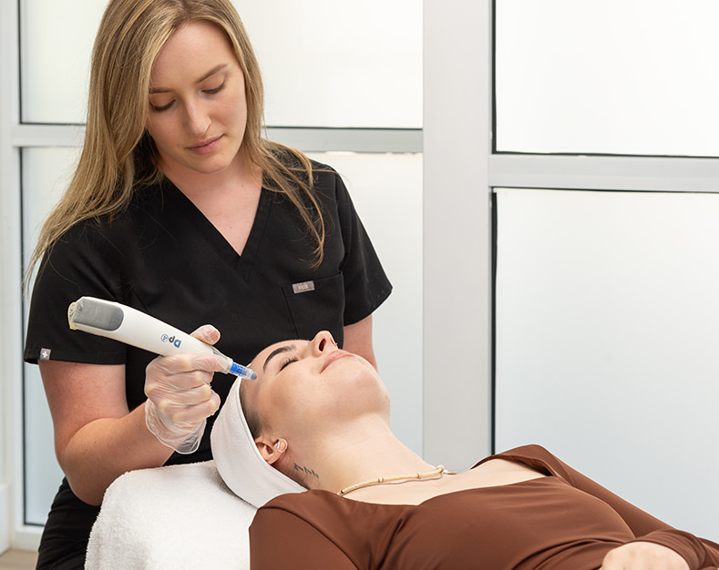 Patient receiving a microneedling treatment